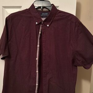 Cool polka dot burgundy short sleeve button down w/ white flip design on sleeve.